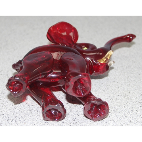 1612 - Attributed to Vetreira Artistica Barovier or Martinuzzi, a small red glass model of an elephant walk... 