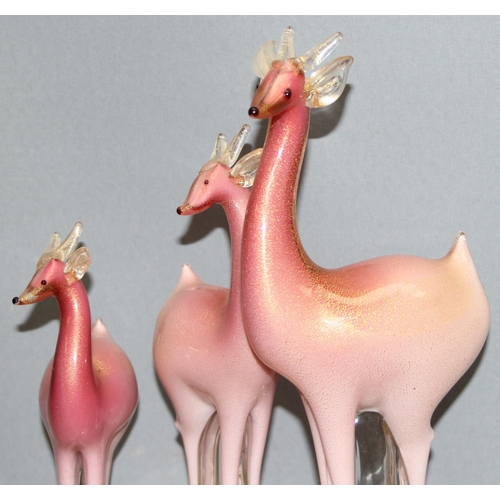 1618 - Murano/ Italian Glass, a large glass sculpture of a trio of pink deer on glass base, with gold leaf ... 