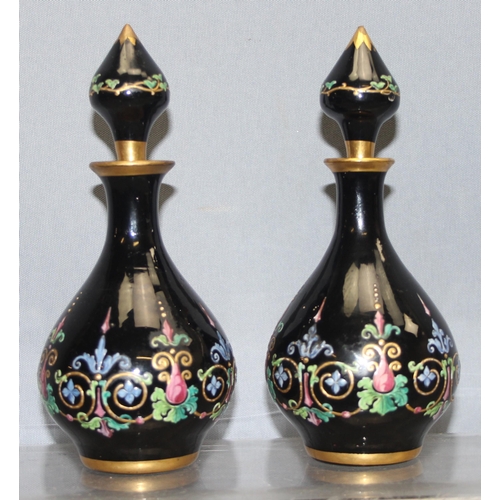 1620 - Ludwig Moser & Sons, Bohemia - two black glass and floral enamelled perfume bottles and stoppers, ea... 