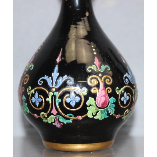 1620 - Ludwig Moser & Sons, Bohemia - two black glass and floral enamelled perfume bottles and stoppers, ea... 