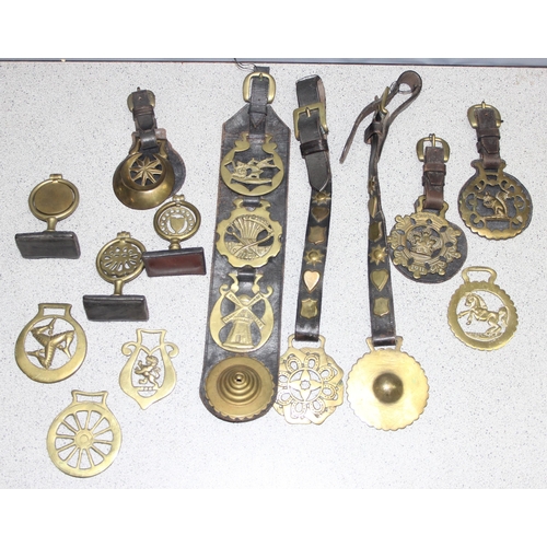 1702 - Qty of assorted antique and later horse brasses, some likely 19th century and with some leather stra... 