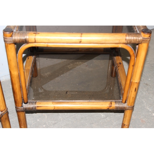 20 - A pair of retro bamboo and smoked glass side tables, each approx 49cm wide x 44cm deep x 52cm tall