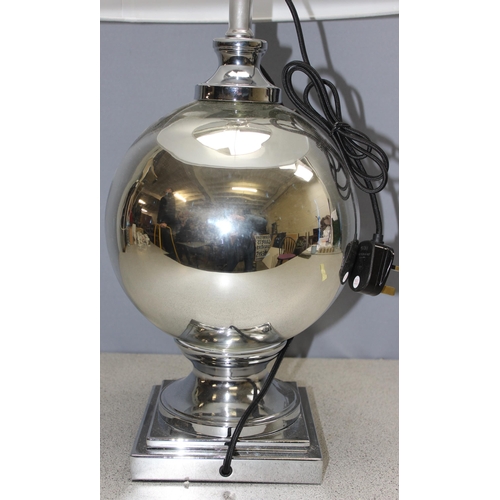 237 - A large mirrored glass table lamp with shade, approx 68cm tall