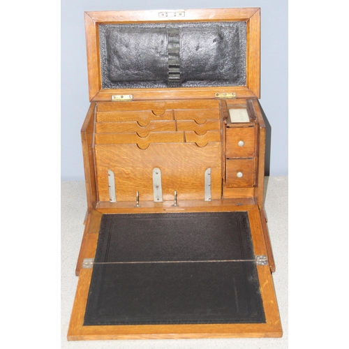 273 - A superb quality antique oak desktop stationary box, with various compartments and leather slope, ap... 