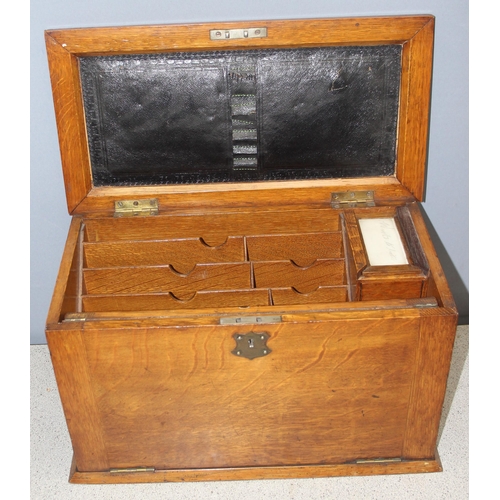 273 - A superb quality antique oak desktop stationary box, with various compartments and leather slope, ap... 