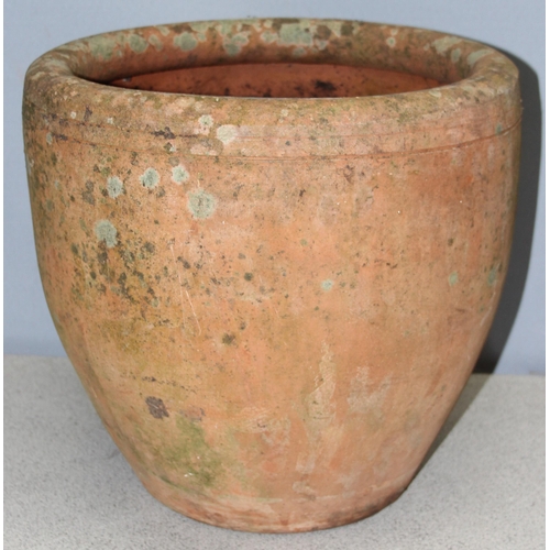 301 - A large weathered terracotta garden planter, approx 36cm tall x 36cm in diameter