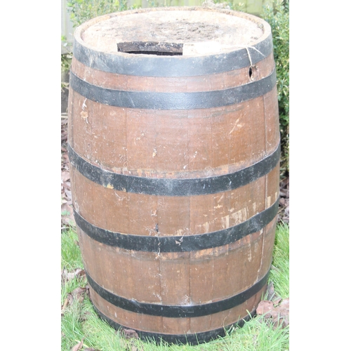 302 - A large vintage coopered oak barrel, approx 56cm in diameter x 89cm tall