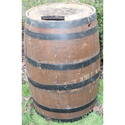 302 - A large vintage coopered oak barrel, approx 56cm in diameter x 89cm tall