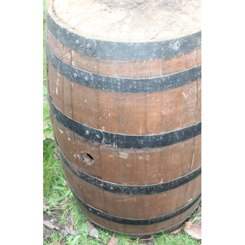 302 - A large vintage coopered oak barrel, approx 56cm in diameter x 89cm tall