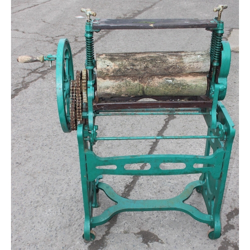 305 - A vintage green painted Pioneer brand cast iron mangle with wooden rollers, approx 102cm wide x 124c... 