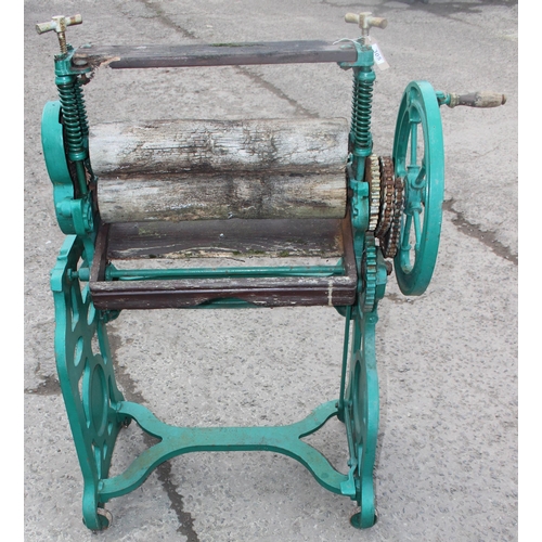 305 - A vintage green painted Pioneer brand cast iron mangle with wooden rollers, approx 102cm wide x 124c... 