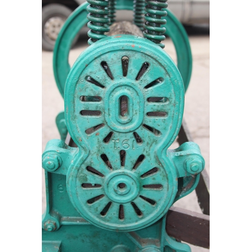 305 - A vintage green painted Pioneer brand cast iron mangle with wooden rollers, approx 102cm wide x 124c... 