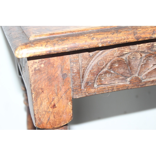 6 - An antique carved oak joint or coffin stool, 1 of 2 very similar in the sale, approx 46cm wide x 28c... 