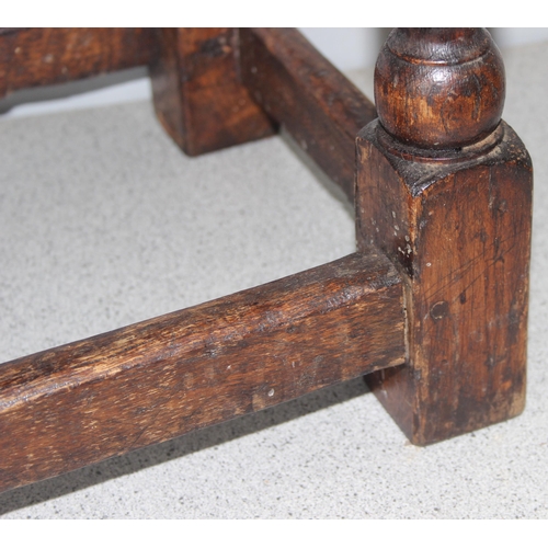 6 - An antique carved oak joint or coffin stool, 1 of 2 very similar in the sale, approx 46cm wide x 28c... 