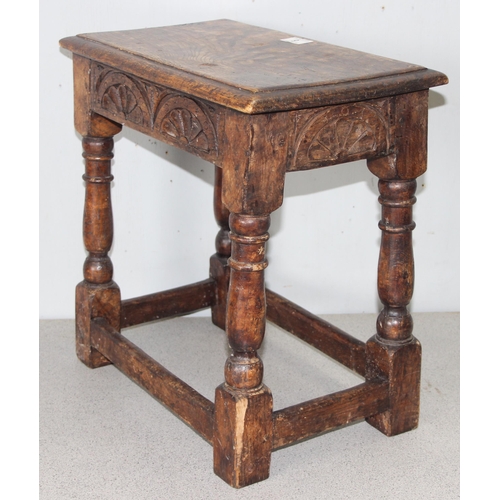 6 - An antique carved oak joint or coffin stool, 1 of 2 very similar in the sale, approx 46cm wide x 28c... 