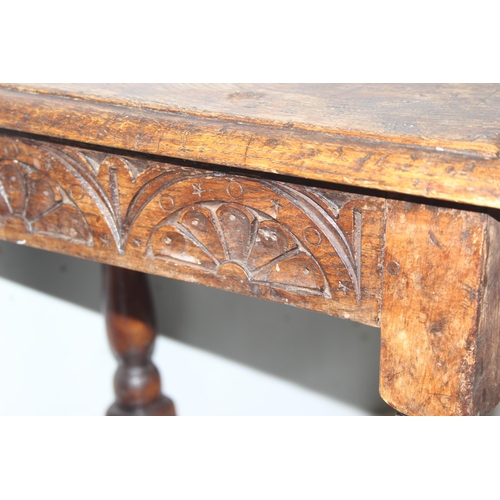 6 - An antique carved oak joint or coffin stool, 1 of 2 very similar in the sale, approx 46cm wide x 28c... 