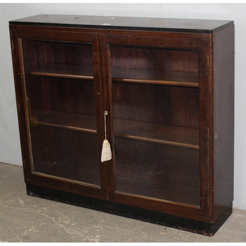 64 - A vintage wooden bookcase with glazed door, approx 112cm wide x 28cm deep x 100cm tall