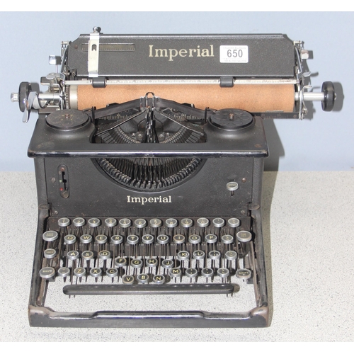 650 - A large vintage Imperial typewriter with leather cover