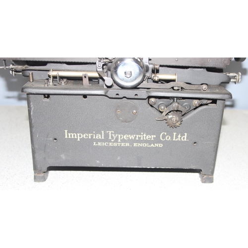 650 - A large vintage Imperial typewriter with leather cover