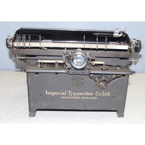 650 - A large vintage Imperial typewriter with leather cover