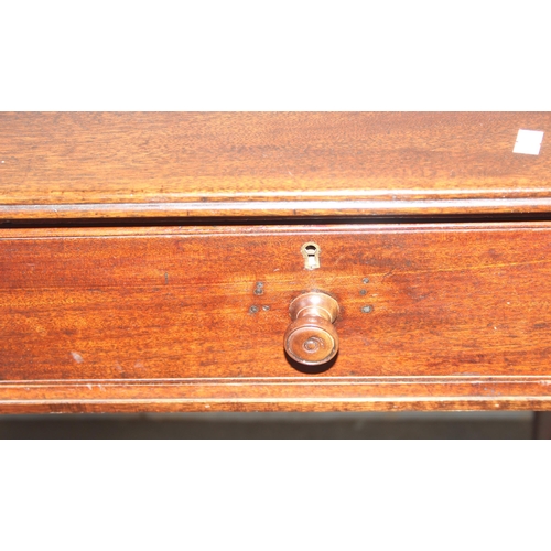 68 - A small 19th century mahogany desk with 2 drawers and turned legs, approx 101cm wide x 55cm deep x 7... 