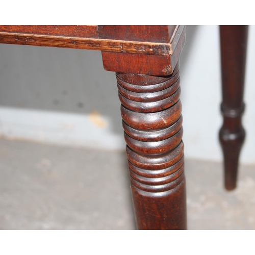 68 - A small 19th century mahogany desk with 2 drawers and turned legs, approx 101cm wide x 55cm deep x 7... 