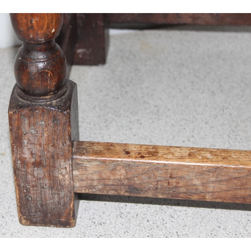 7 - An antique carved oak joint or coffin stool, 1 of 2 very similar in the sale, approx 46cm wide x 28c... 