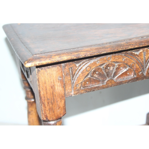 7 - An antique carved oak joint or coffin stool, 1 of 2 very similar in the sale, approx 46cm wide x 28c... 