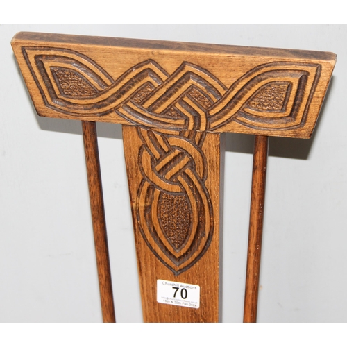 70 - Ben Setter of Totnes, a carved oak spinning chairs with Celtic designed motif, approx 24cm wide x 78... 