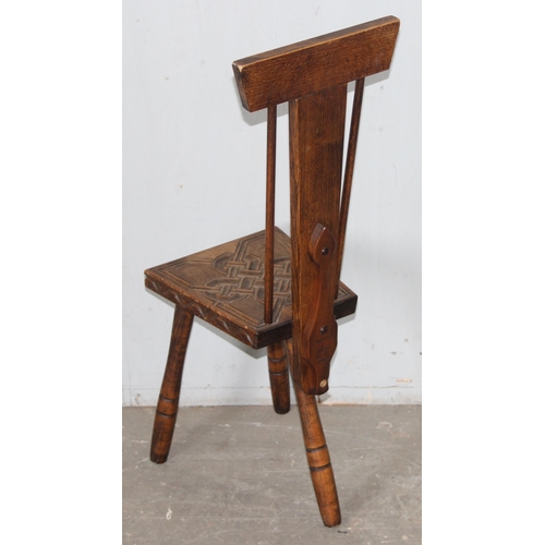 70 - Ben Setter of Totnes, a carved oak spinning chairs with Celtic designed motif, approx 24cm wide x 78... 