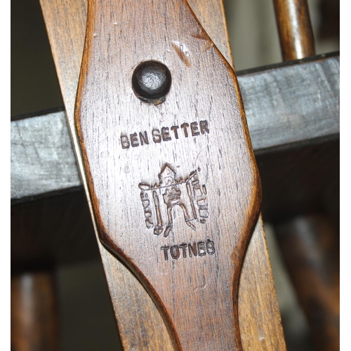 70 - Ben Setter of Totnes, a carved oak spinning chairs with Celtic designed motif, approx 24cm wide x 78... 