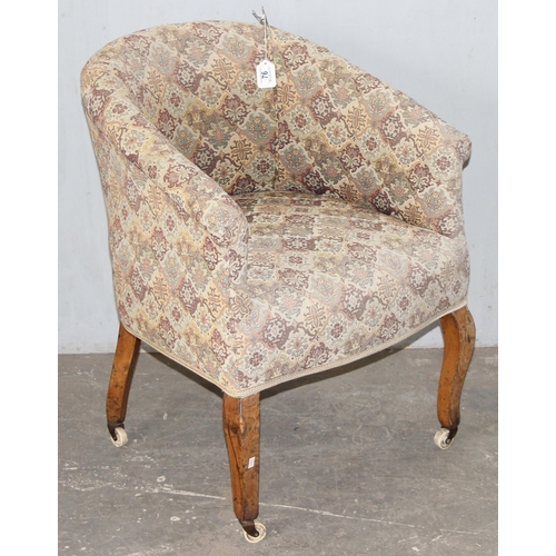 76 - A vintage upholstered tub chair with wooden legs and patterned upholstery, approx 61cm wide x 82cm t... 