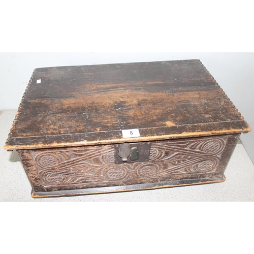 8 - An antique carved oak bible box, likely 18th century or earlier, with ironwork fittings, approx 59cm... 