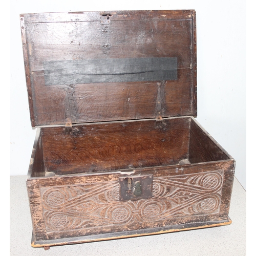 8 - An antique carved oak bible box, likely 18th century or earlier, with ironwork fittings, approx 59cm... 