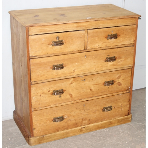 83 - An antique stripped pine 2 over 3 chest of drawers with brass cup handles, approx 95cm wide x 48cm d... 