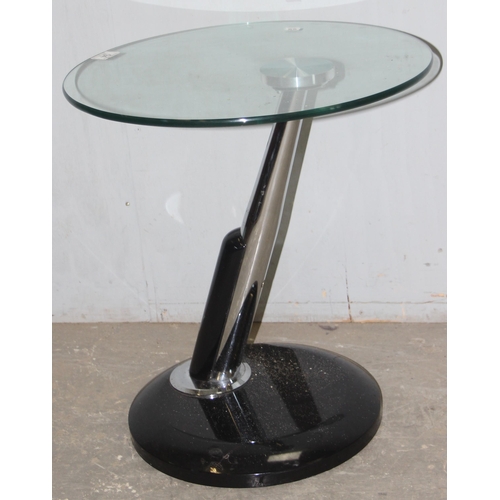 94 - A retro style offset glass and chrome side table, approx 48cm in diameter x 50cm tall