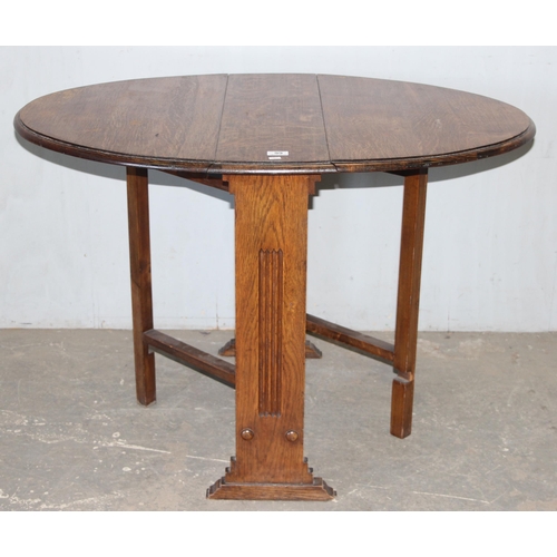 99 - An Art Deco period oak drop leaf table, approx 108cm wide x 77cm deep x 74cm tall