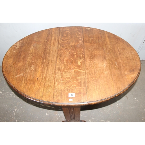 99 - An Art Deco period oak drop leaf table, approx 108cm wide x 77cm deep x 74cm tall