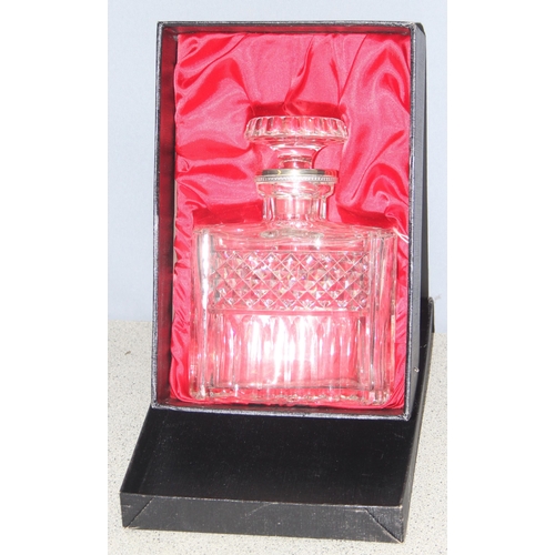 1656 - A vintage boxed crystal and silver plated decanter, approx 22cm tall