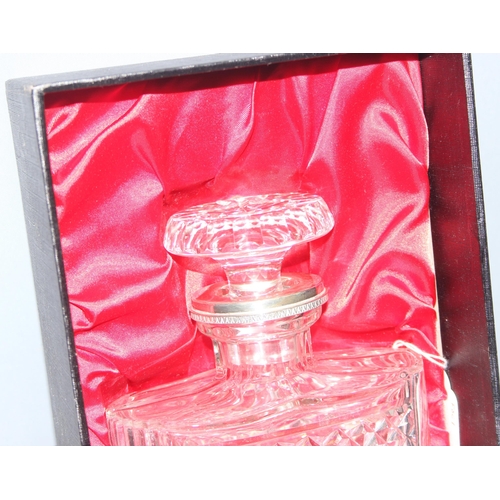 1656 - A vintage boxed crystal and silver plated decanter, approx 22cm tall