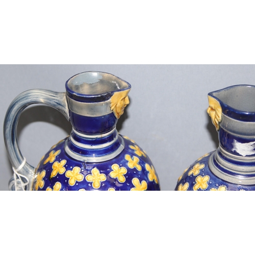 1658 - A matched pair of Minton Majolica water jugs, footed bulbous form, decorated with yellow quatrefoils... 