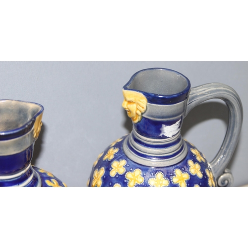 1658 - A matched pair of Minton Majolica water jugs, footed bulbous form, decorated with yellow quatrefoils... 