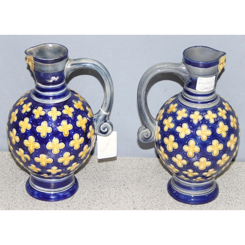 1658 - A matched pair of Minton Majolica water jugs, footed bulbous form, decorated with yellow quatrefoils... 