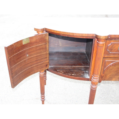 142 - A 19th century mahogany sideboard with 2 cupboards flanking 2 central drawers, approx 186cm W x 66cm... 