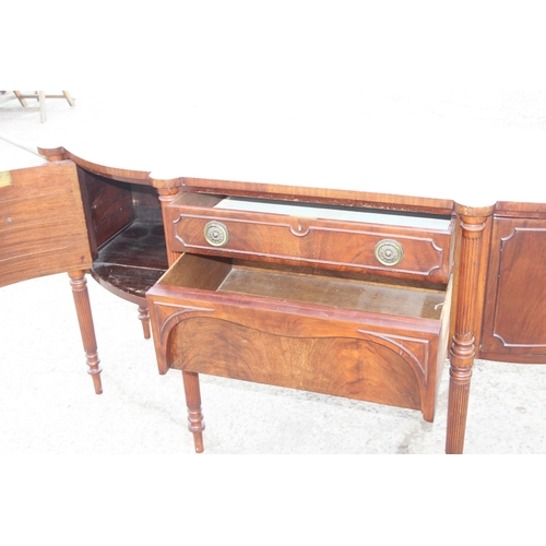 142 - A 19th century mahogany sideboard with 2 cupboards flanking 2 central drawers, approx 186cm W x 66cm... 