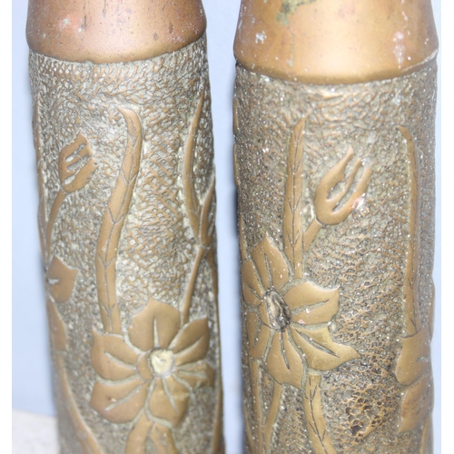 1427 - Pair of WW2 trench art shell vases with Art Nouveau floral design, approx 23cm tall