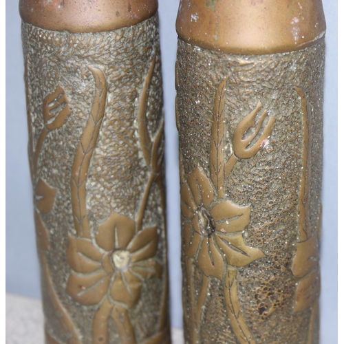 1427 - Pair of WW2 trench art shell vases with Art Nouveau floral design, approx 23cm tall