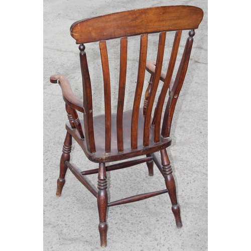 145 - An antique elm seated farmhouse Windsor slatback armchair, approx 60cm W x 47cm D x 116cm H