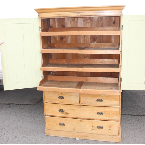 150 - A Victorian pine linen press cabinet, the top cabinet containing 4 slide out drawers, the base a 2/2... 