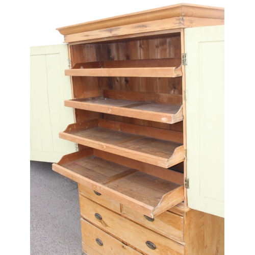 150 - A Victorian pine linen press cabinet, the top cabinet containing 4 slide out drawers, the base a 2/2... 